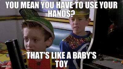 Back to the Future Part II clip of two boys at an arcade cabinet, captioned "You mean you have to use your hands? That's like a baby's toy"